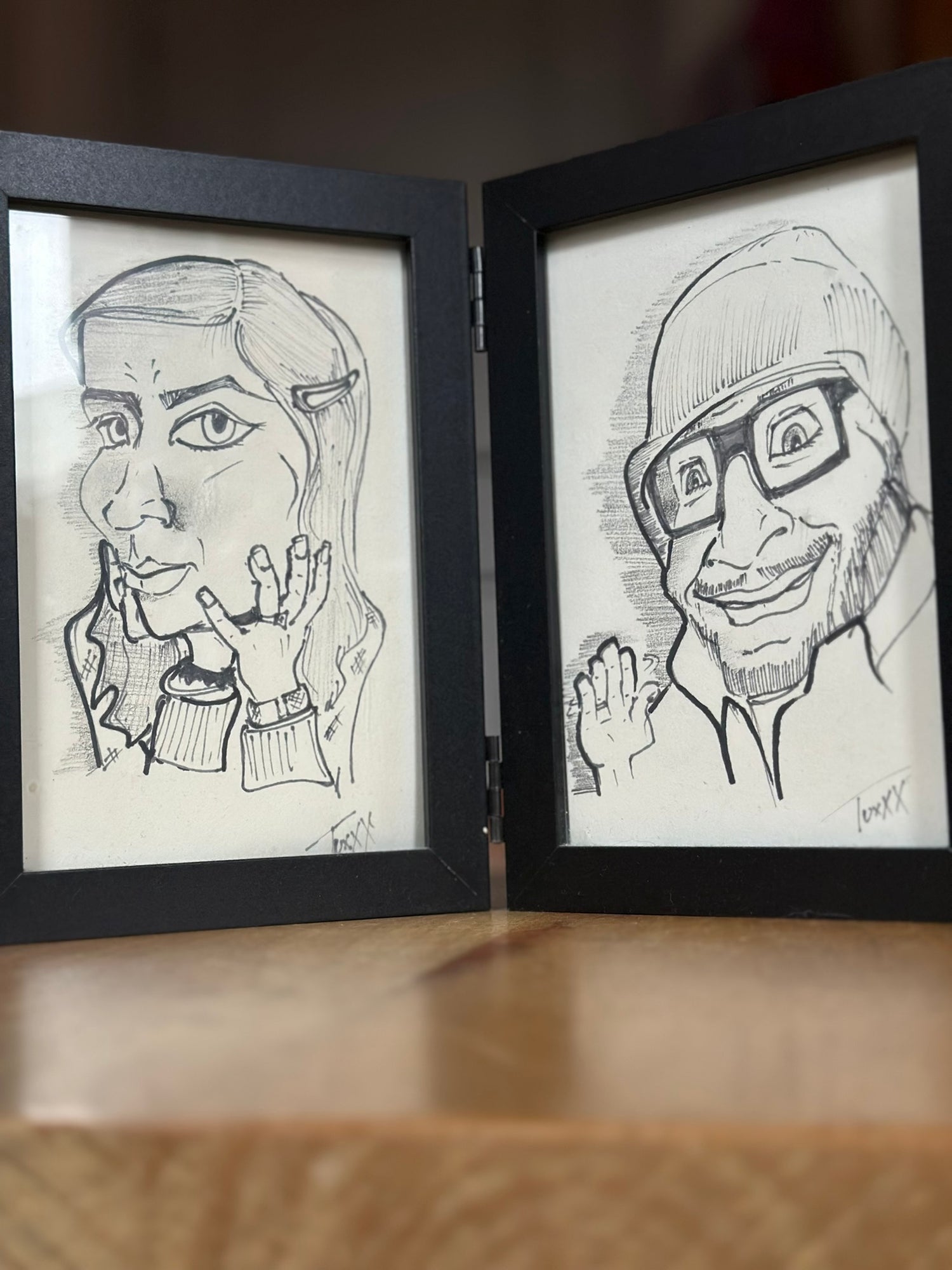 Picture frames with caricatures of aCowsTail and aCrowsFeet