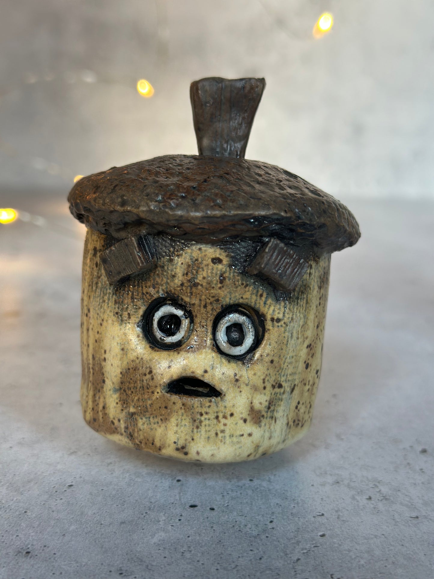 ceramic acorn on decorative background