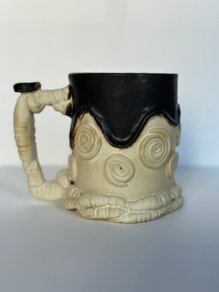 Ceramic mug with unique design on a white background