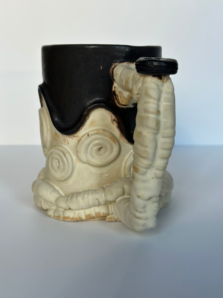 Ceramic mug handle on a white background