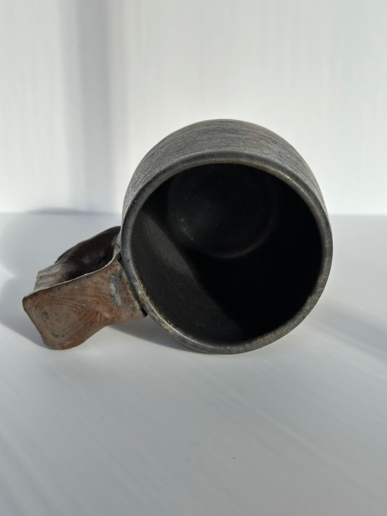 Ceramic mug top view on a white background